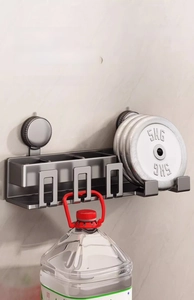 Wall-mounted suction cup storage rack demonstrating strong load-bearing capacity
