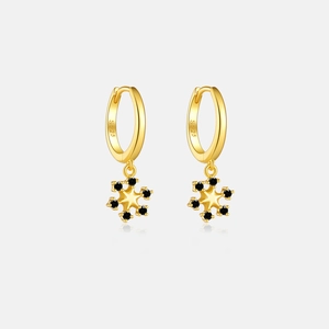 Macro view of S925 sterling silver snowflake earrings with black stones and gold finish