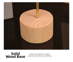 Macro detail of natural solid wood base with gold metal rod and stable thick design