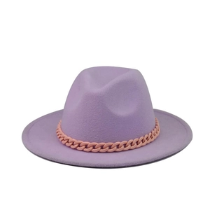 Close-up of lavender wool fedora hat featuring a chunky pink fashion chain decoration