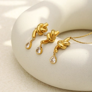 18K gold plated knotted necklace and earrings set with pear cut cubic zirconia stones