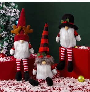 Detailed close-up of plush Christmas gnomes with reindeer antlers and festive hats