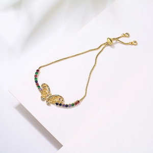Detail of a 18K gold-plated butterfly bracelet with multi-color zircon stones and pull-cord