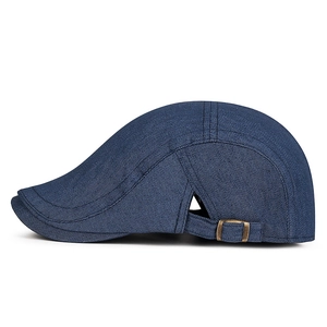 Unisex dark blue denim flat cap with adjustable metal buckle and vintage stitch detail