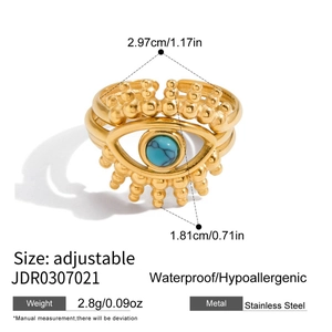 Detail of 18K gold stainless steel adjustable ring with zircon evil eye and beaded band