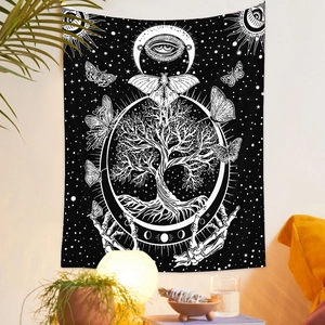 Detail of bohemian black and white tapestry showing Tree of Life and moth in a cozy room