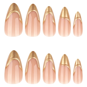 Almond shaped nude pink press-on nails set with 3D metallic gold tips and vertical stripes