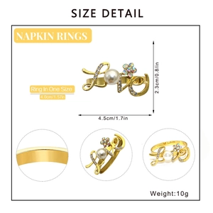 Size detail of golden LOVE napkin ring with pearls, rhinestones, and measurements
