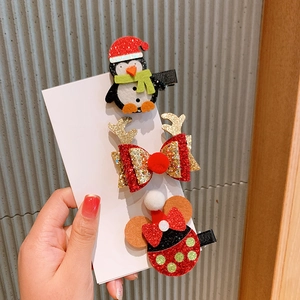 Detailed set of Christmas hair clips featuring sequined antlers and Minnie mouse style bow