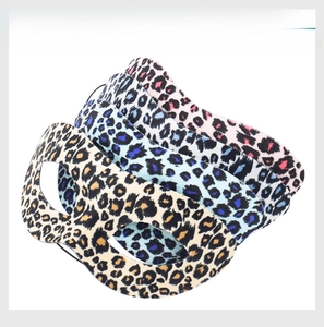 Detailed view of leopard print sleep masks in yellow, blue, white, and pink fabric options