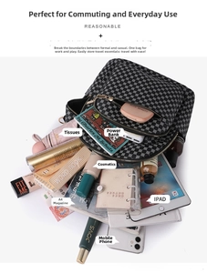Spacious black and white geometric backpack showing storage for tablet and cosmetics