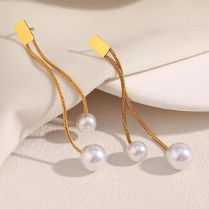 Vintage 18K gold plated stainless steel fringe earrings with faux pearls on white tray
