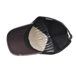 Detail view of washed black baseball cap interior with sweatband and stitching