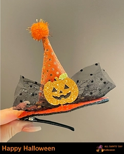 Detail of Halloween hair clip with sequined pumpkin, witch hat and black polka dot mesh