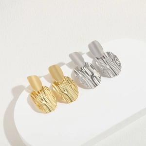 Fashionable 14K gold plated earrings with irregular textured wave design for women