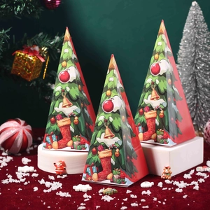 Pyramid-shaped Christmas candy boxes with festive cartoon tree patterns on velvet surface
