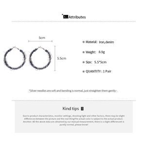 Detail showing blue denim fabric wrapped C-shaped hoop earrings with size specifications