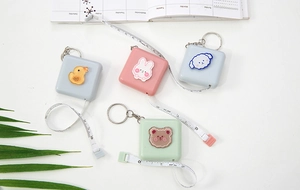 Detail of four cartoon mini measuring tapes featuring duck, rabbit, dog and bear shapes
