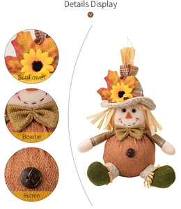 Detail view of harvest scarecrow doll featuring sunflower, bowtie, and button accents