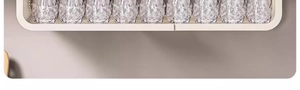 Close-up of white metal wire shelf holding textured glass cups in a kitchen cabinet