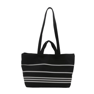Minimalist canvas tote bag with black and white horizontal stripes and dual shoulder straps