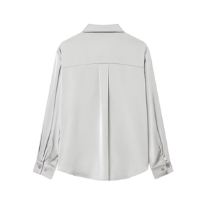 Back view of silver satin shirt showing pleat detail and premium silky fabric texture