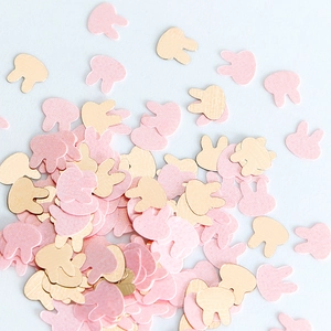Detailed view of pink and gold bunny shaped nail art sequins for DIY craft decoration