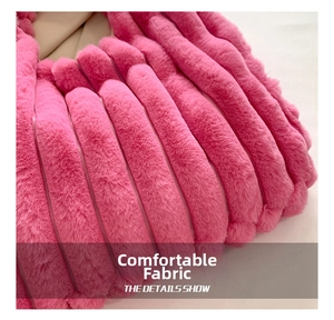 Macro shot of pink faux fur material with vertical stripe texture and soft plush fibers