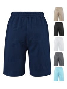 Detail of waffle textured knit fabric and elastic waistband on men's striped casual shorts