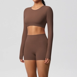 Two-piece cocoa brown yoga set featuring long sleeve crop top and high-waist biker shorts
