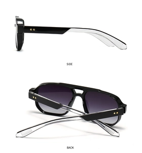 Detail of pilot sunglasses with gold rivets, transparent temple tips and purple gradient lenses