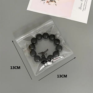 Detailed view of 13x13cm thick transparent PVC ziplock bag showing jewelry storage capacity