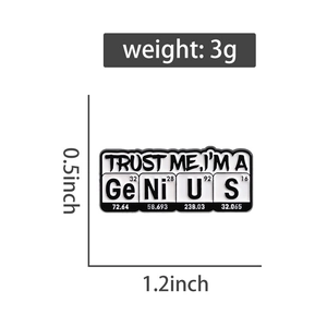 Detail shot of science brooch with Trust Me I'm a Genius text and chemical elements