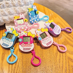Detailed view of mini retro game console keychains with colorful cartoon designs