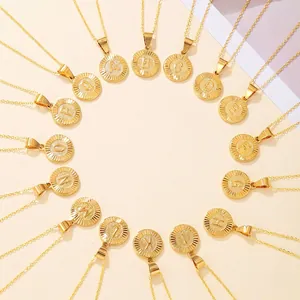 Golden geometric alphabet pendant necklaces with engraved round letter charms on fine chains