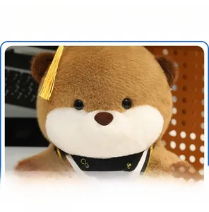 Close-up of cute graduation otter plush with black mortarboard and congratulations scarf