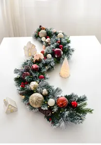 Close-up of 135cm snowy Christmas rattan with LED lights, pine cones and red berries