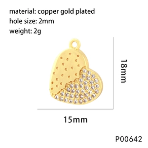 Macro shot of gold-plated heart pendant with zircons and 2mm hole size details