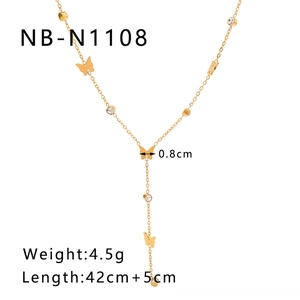 Detailed view of 18K gold butterfly necklace pendant with zircon and tassel chain
