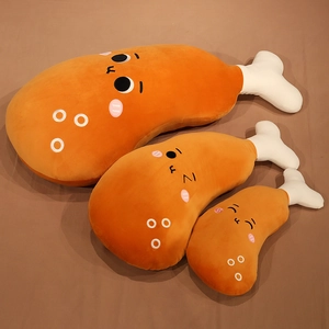 Detailed macro view showing three sizes of adorable cartoon fried chicken leg plush pillows