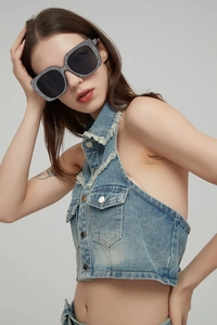 Close-up of black oversized square sunglasses with sparkling white rhinestone frame