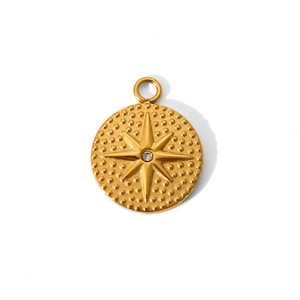 Macro view of a gold-plated stainless steel star pendant with a clear gemstone center