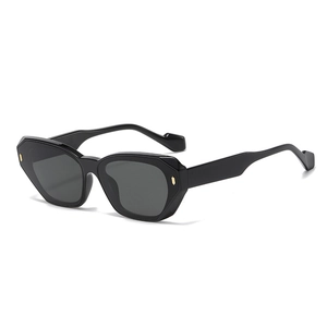 Chic black rectangular sunglasses with golden metal accents and dark UV lenses
