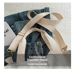 Detail of soft corduroy fabric shoulder bag with adjustable canvas strap and gold buckle