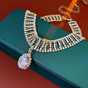 Detail of elegant silver choker with cascading rhinestones and oval-cut zircon pendant