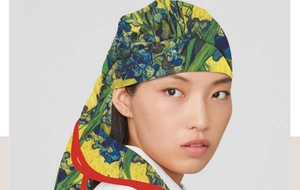 Detail of artistic oil painting scarf featuring premium hem stitching and silk texture