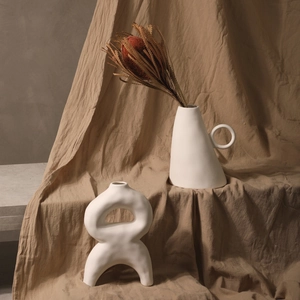 Nordic white ceramic vases in asymmetric cone and hollow ring shapes for home decor