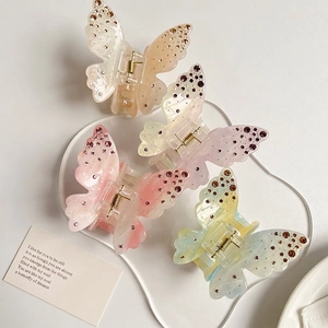 Set of gradient butterfly hair claws with delicate rhinestones in various pastel colors