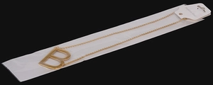 Detail of 18K gold-plated stainless steel necklace with uppercase letter B pendant
