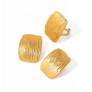 Modern 18K gold-plated stainless steel geometric earrings with wavy texture on white background